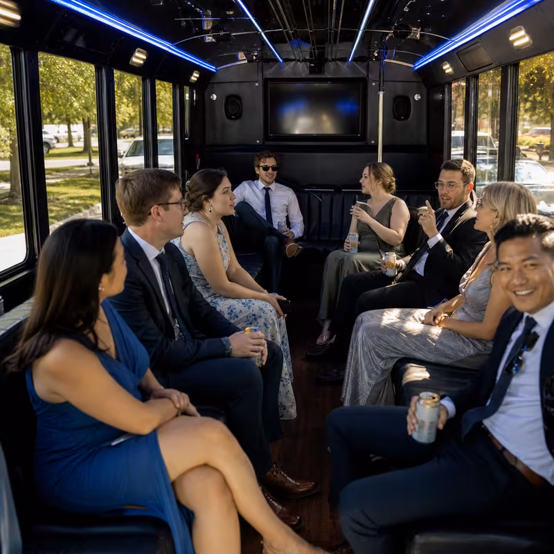 Wedding guests seated inside a Lexington party bus