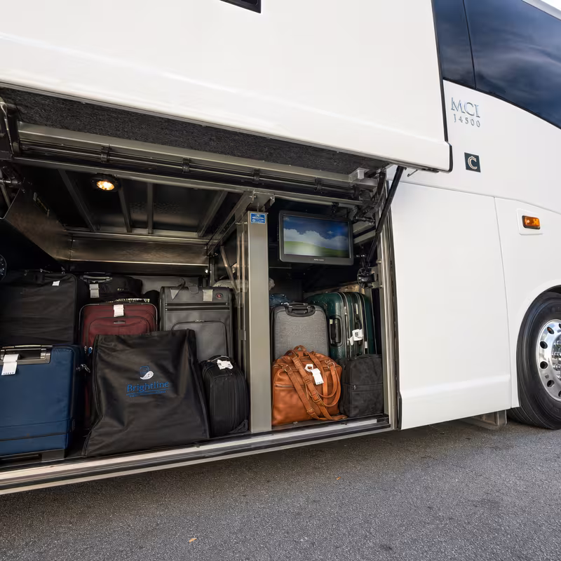 Party bus interior with wraparound leather seating and LED lighting in Lexington
