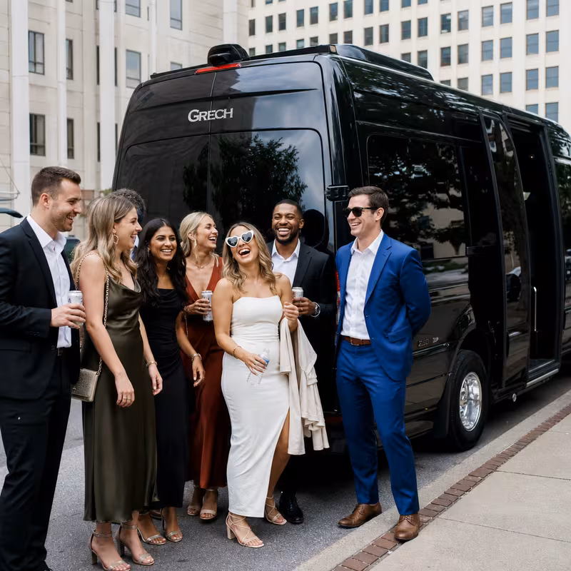 Group boarding a white charter bus for Bachelor & Bachelorette Transportation transportation in Lexington