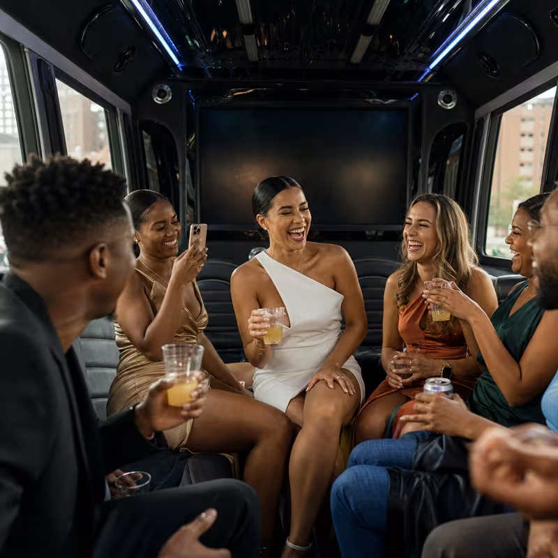 Party bus interior with wraparound leather seating and LED lighting in Lexington