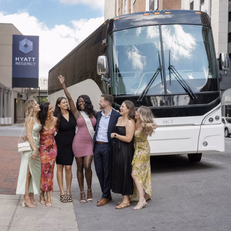 Passengers loading luggage while boarding an Lexington group shuttle