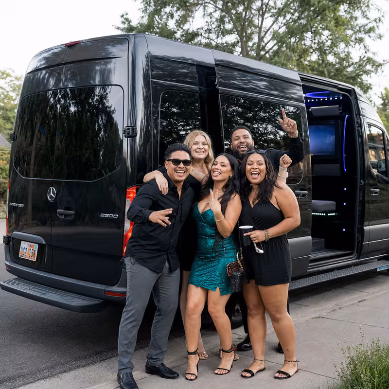 Party bus interior with wraparound leather seating and LED lighting in Lexington