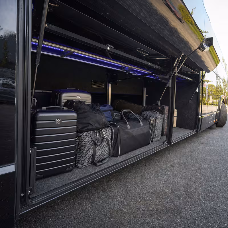 Party bus interior with wraparound leather seating and LED lighting in Lexington