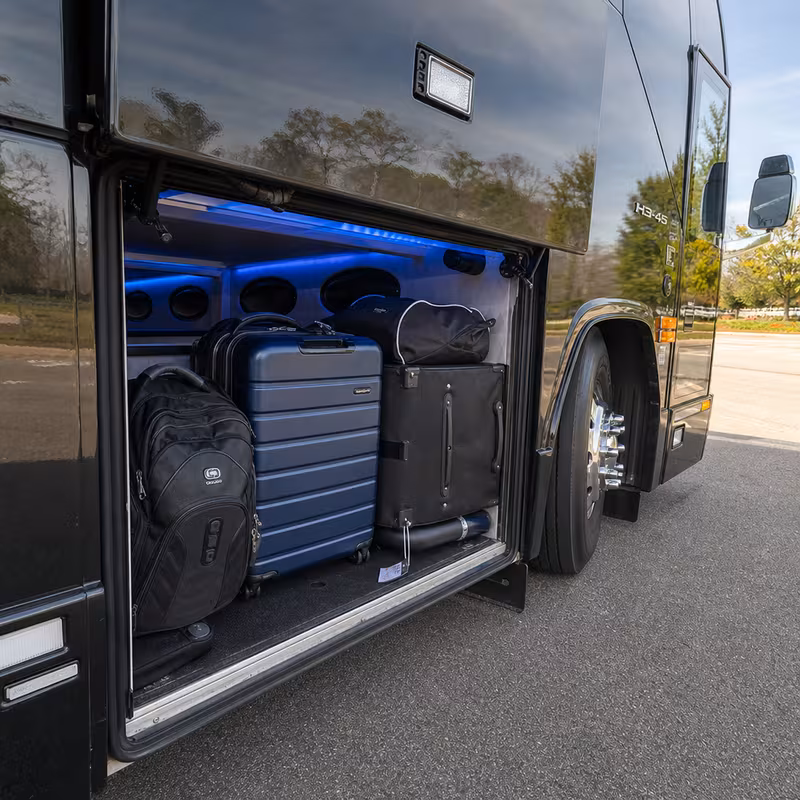 Party bus interior with wraparound leather seating and LED lighting in Lexington