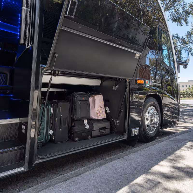 Party bus interior with wraparound leather seating and LED lighting in Lexington
