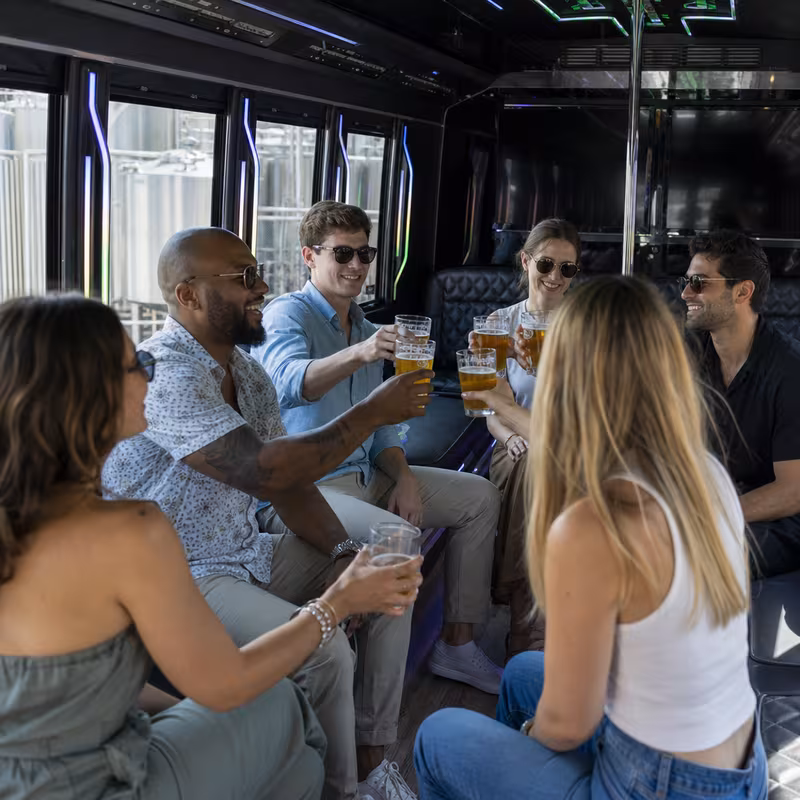 Group boarding a white charter bus for Winery & Brewery Tour Transportation transportation in Lexington