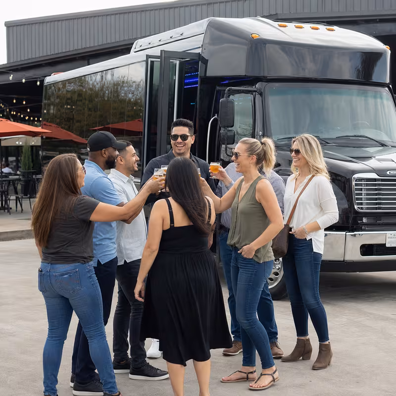 Passengers loading luggage while boarding an Lexington group shuttle